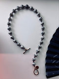 Statement necklace with Dalmatian Jasper and Smoky Quartz beads and gold toggle clasp